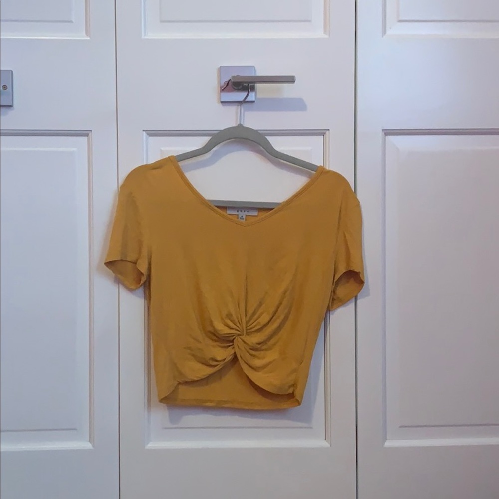 yellow shirt with knot